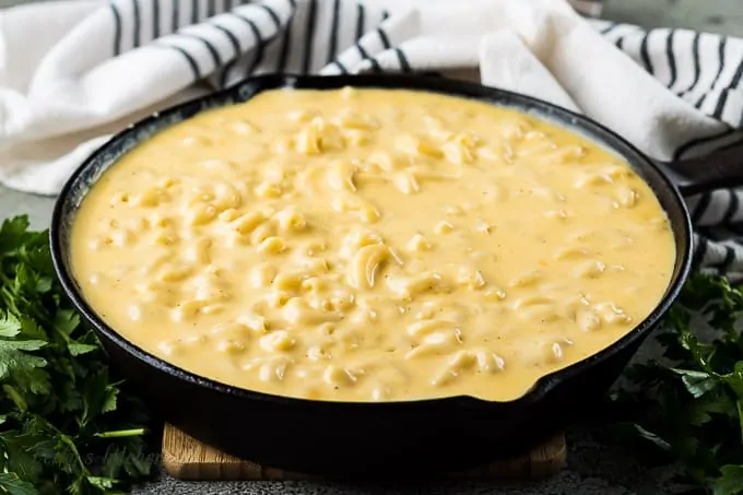 The macaroni and cheese recipe in a cast iron skillet.