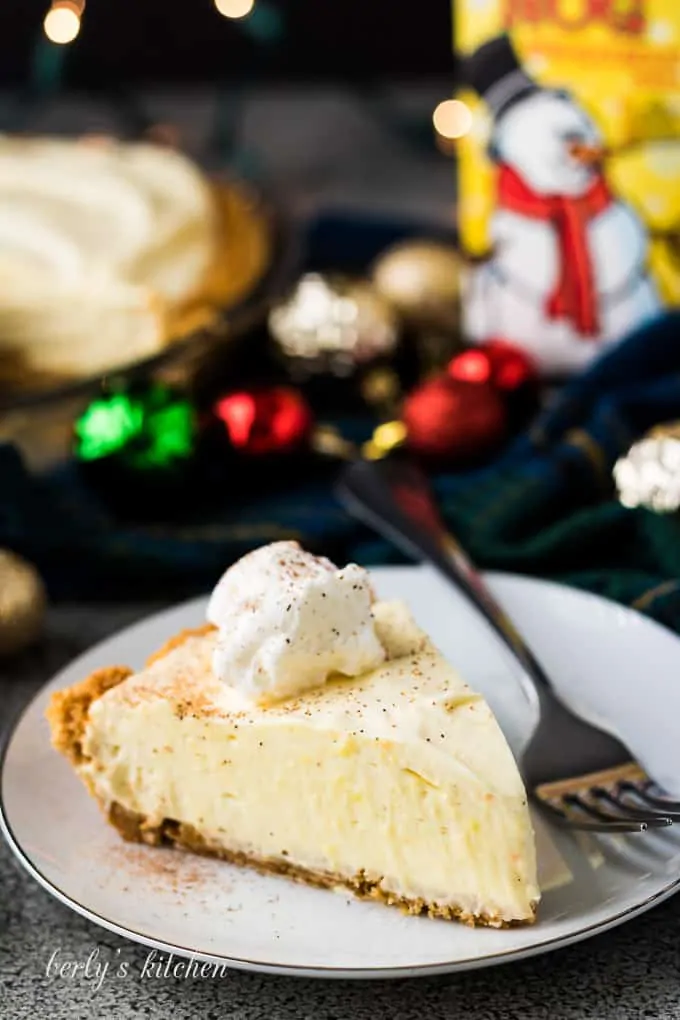 A serving of the eggnog pie topped with whipped topping.