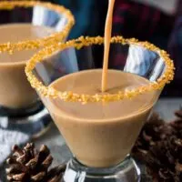 The gingerbread martini cocktail being poured into a chilled glass.