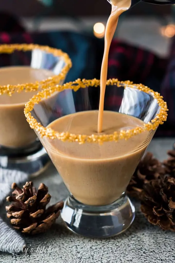 The gingerbread martini cocktail being poured into a chilled glass.