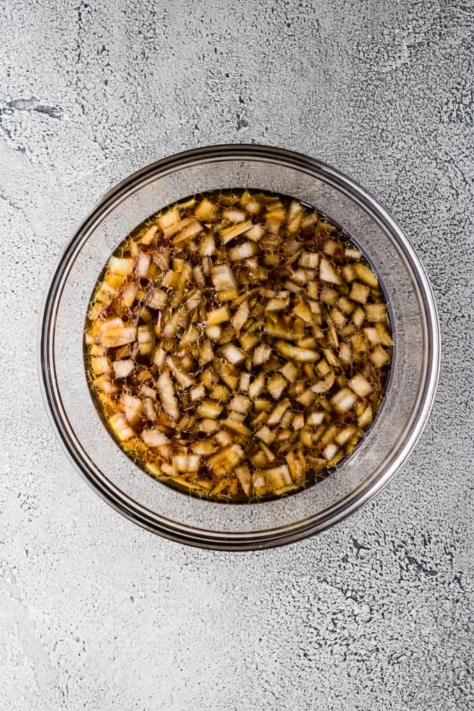 Ginger, soy sauce and other ingredients in a large mixing bowl.