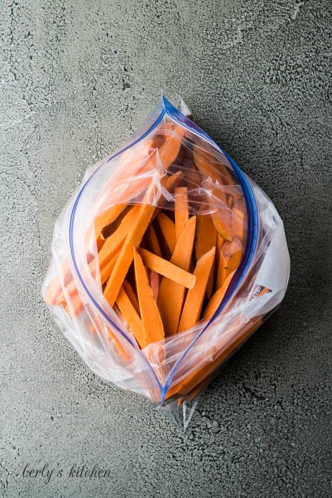 Arial view of sweet potatoes slices in a plastic bag.