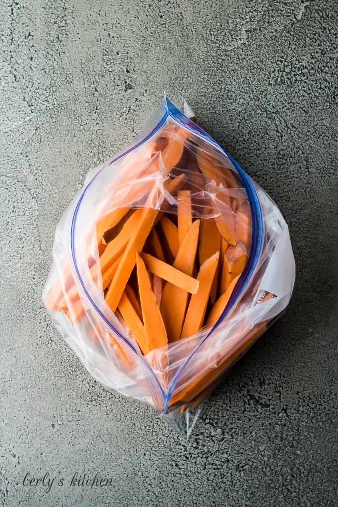 Arial view of sweet potatoes slices in a plastic bag.