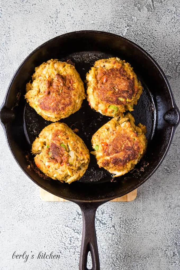 The cakes have been cooked in a cast iron skillet.