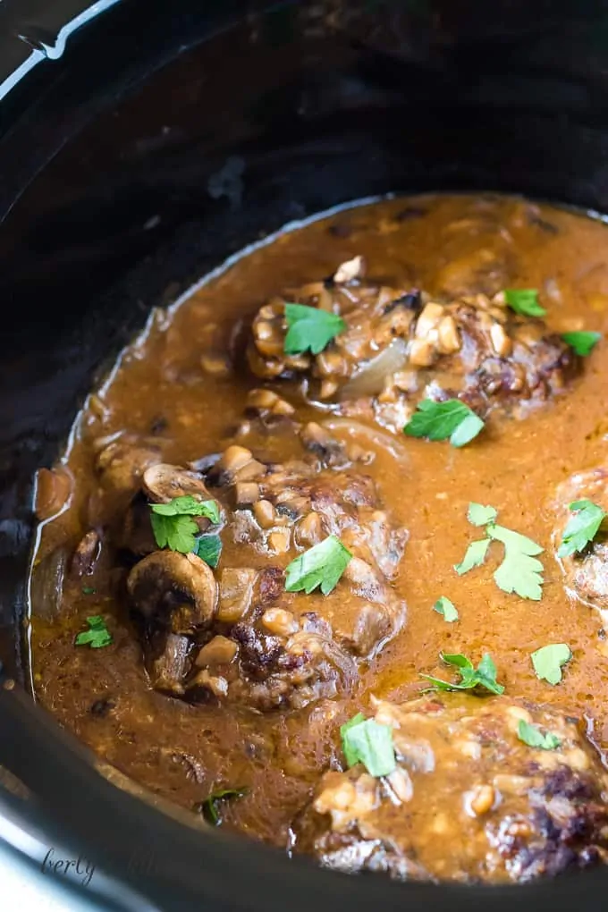 The crockpot salisbury steaks have cooked and are ready to serve.