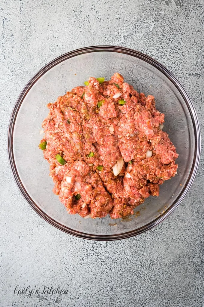 The meatloaf ingredients have been combined in the mixing bowl.