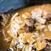 A close up of the finished salisbury steaks with gravy.