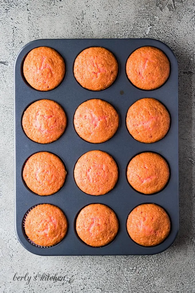 The cupcakes have baked and need to cool before frosting.