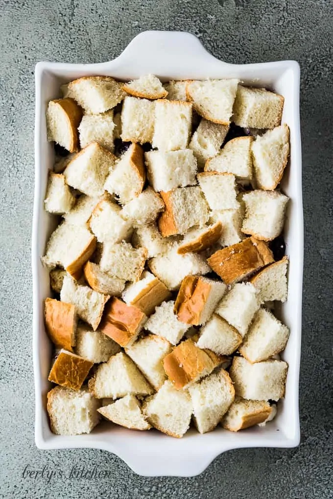 The remaining bread pieces added on top of the cheese and berries.