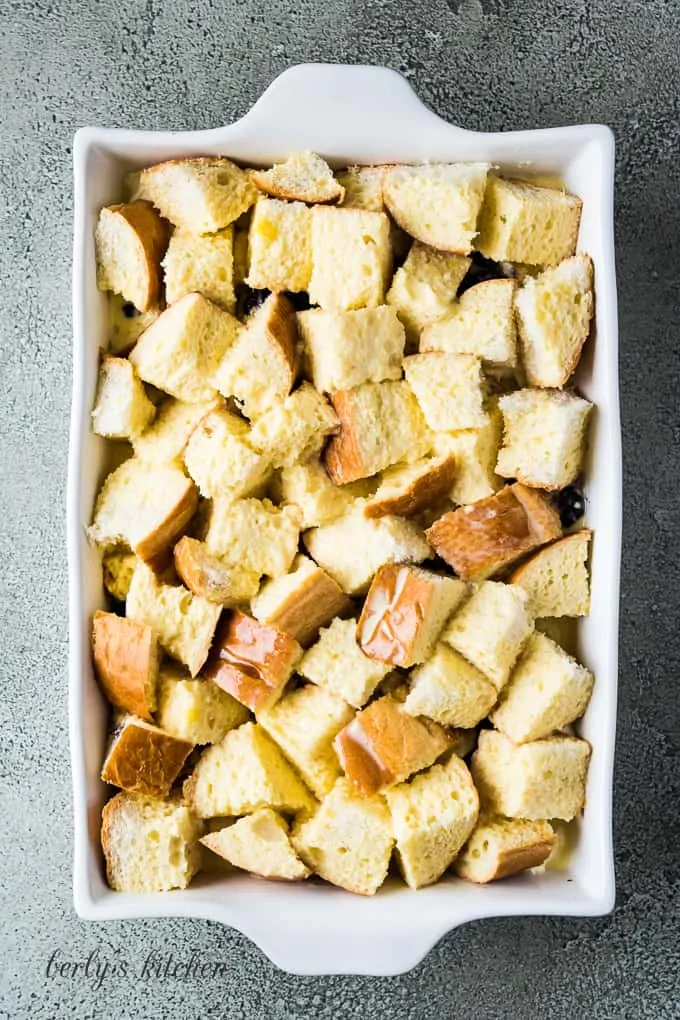 The egg mixture has been poured over the bread cubes.