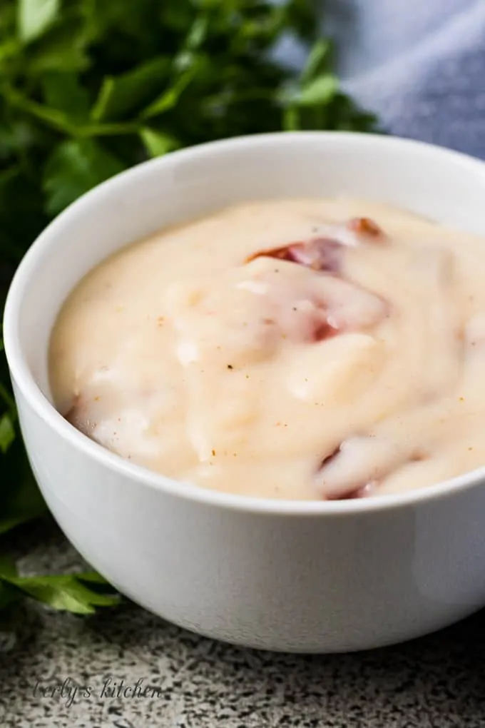 A close-up of the soup showing the bacon pieces.