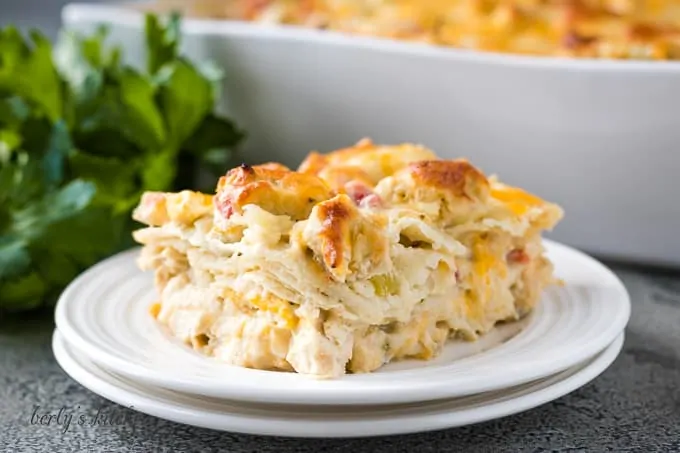 A slice of king ranch chicken on a white plate.