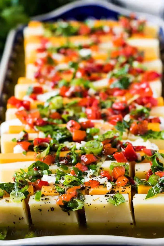 The marinated cheese on a platter showing the colorful recipe.