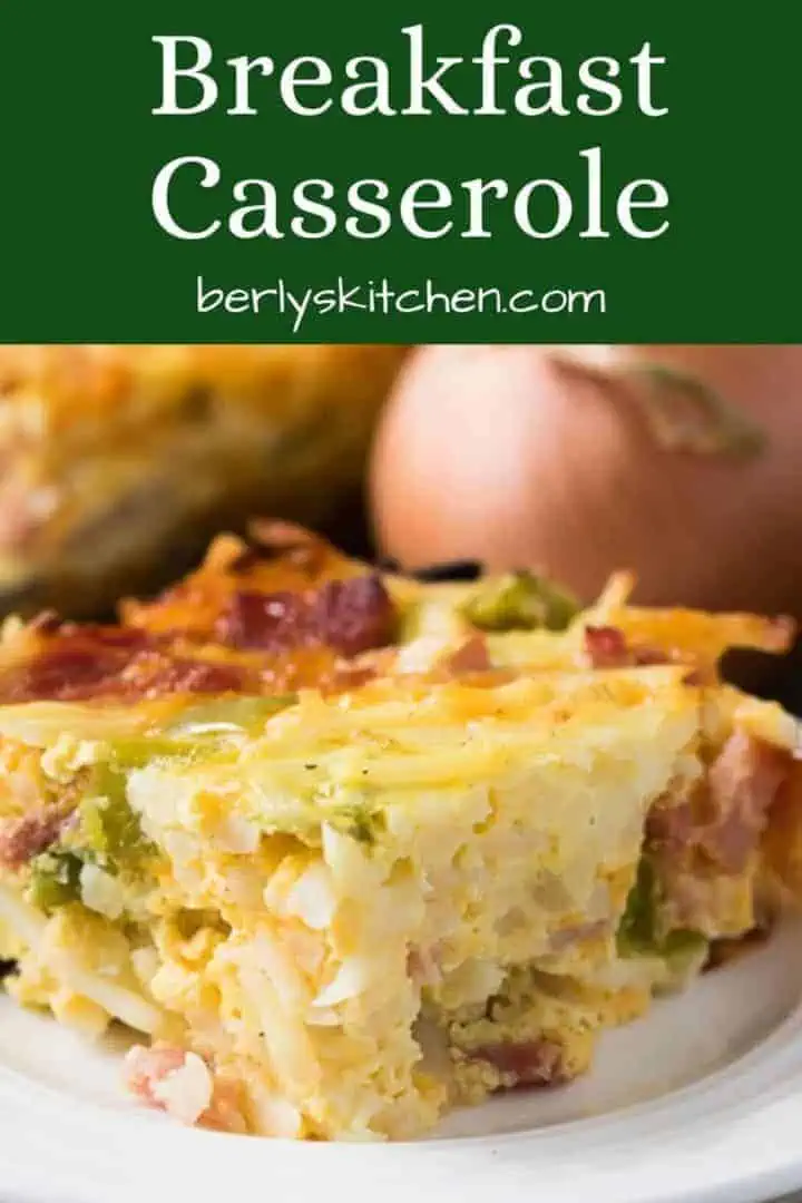 A slice of the cheesy breakfast casserole on a plate.