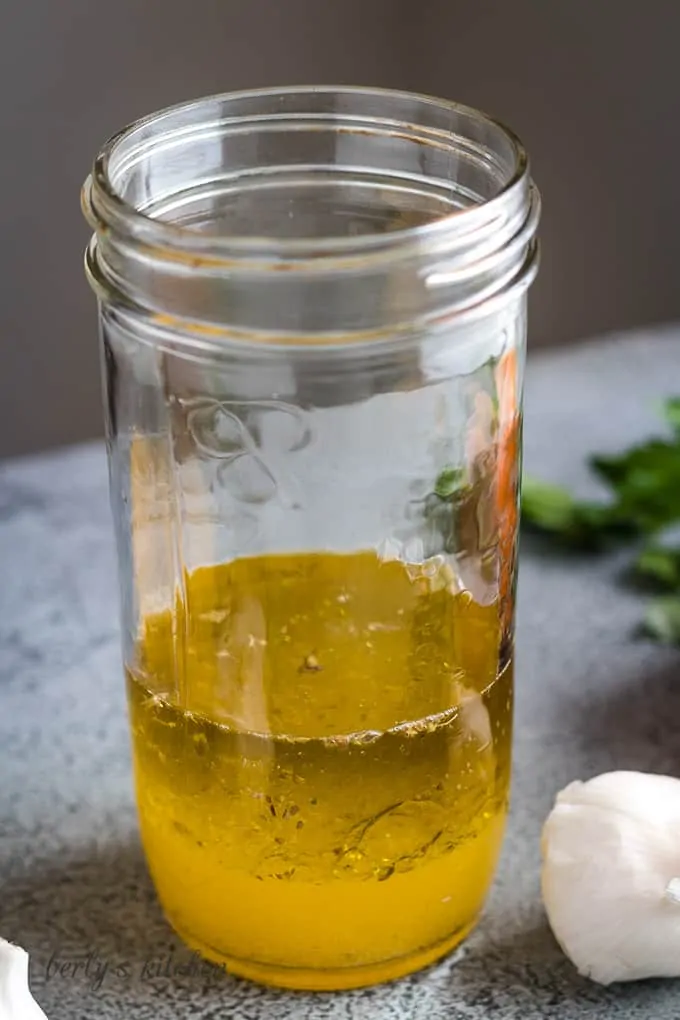 Olive oil, vinegar, and spices added to the citrus juices.