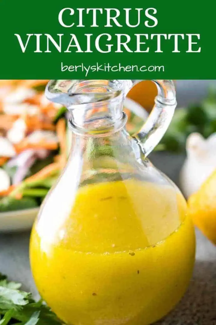 A dressing bottle filled with the citrus vinaigrette.