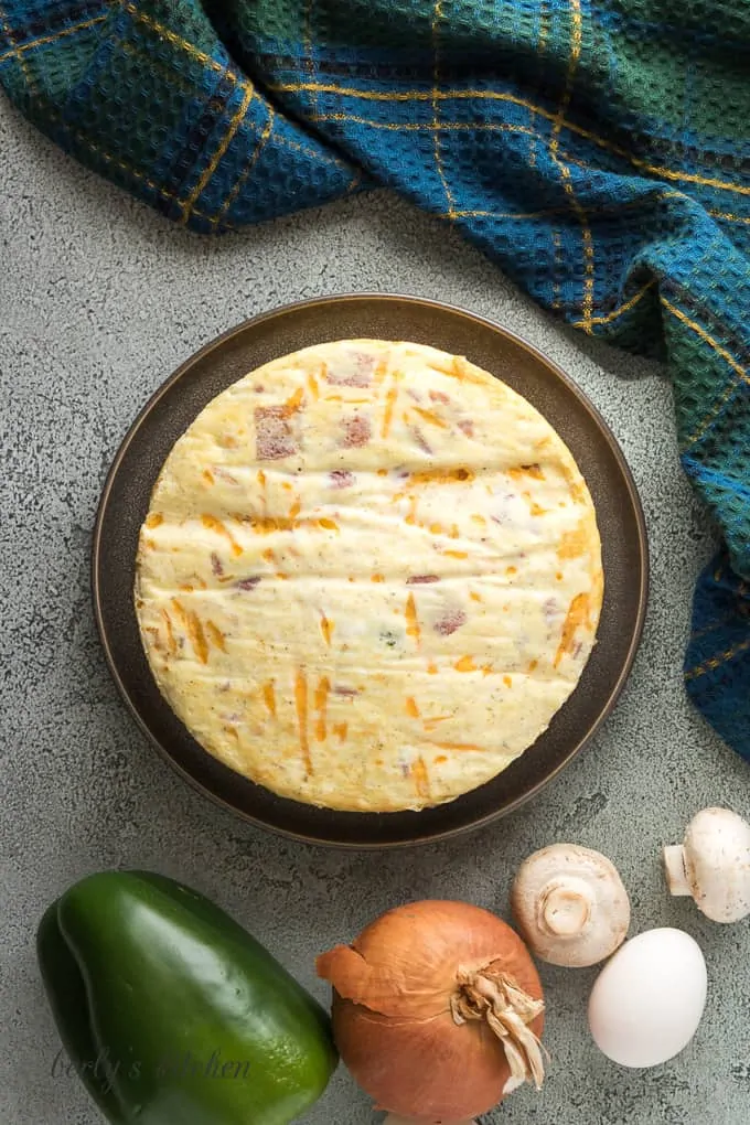 The cooked cheese frittata on a serving dish.