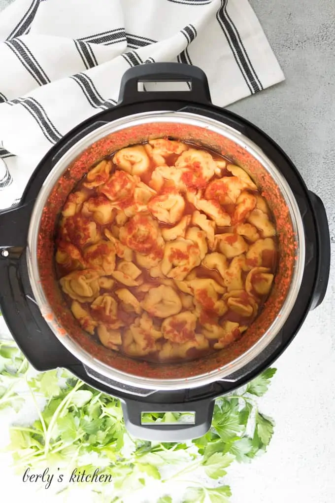 The pasta and tomatoes have pressure cooked in the liner.