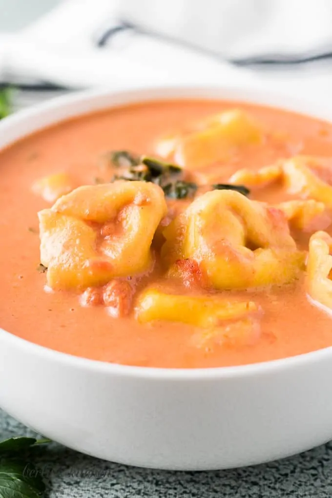 A close-up view of the soup showing pasta and kale.