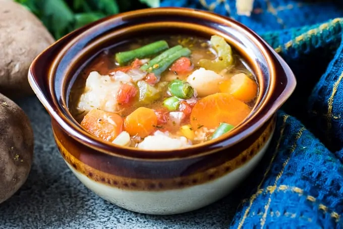 The instant pot vegetable soup in a ceramic bowl.