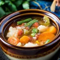 The finished instant pot veggie soup in a bowl.