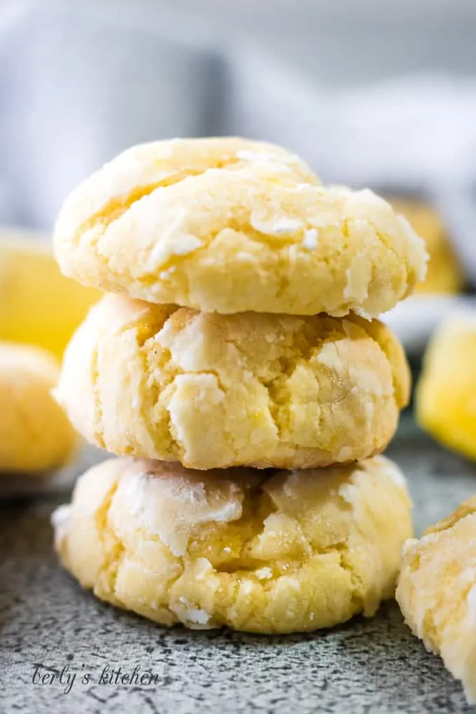 A close-up of three stacked crinkle cookies.