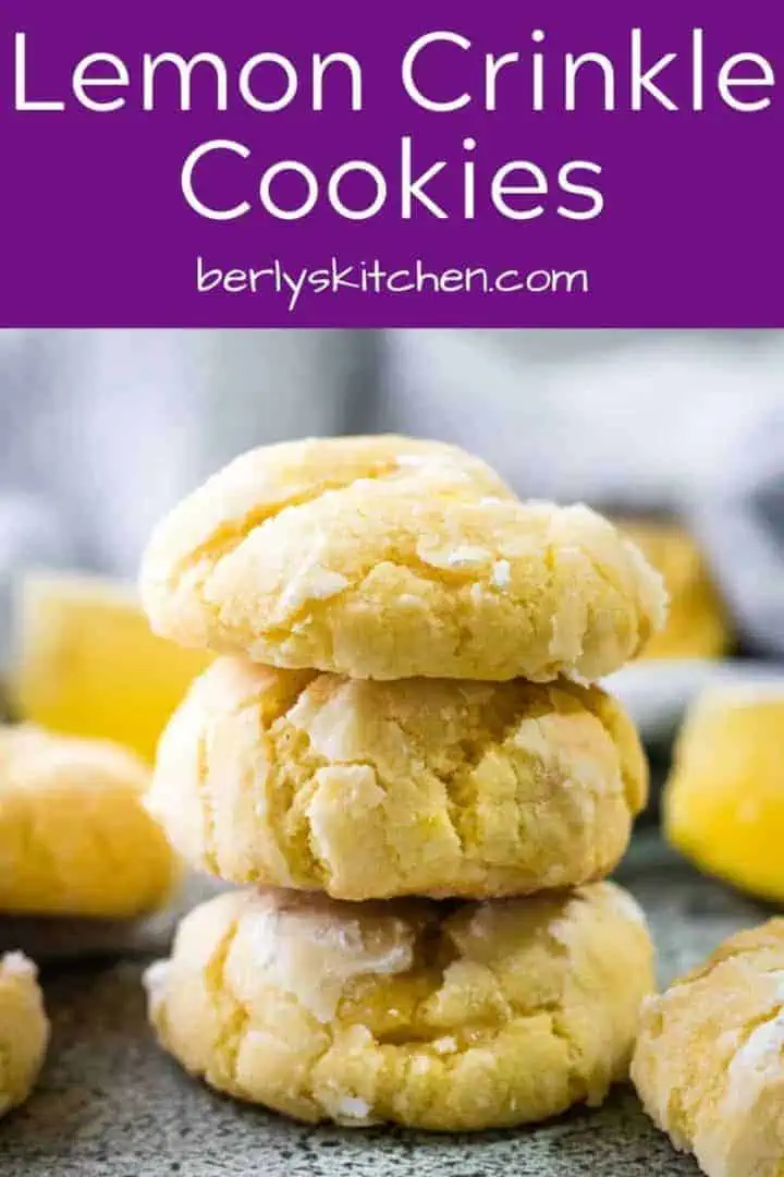 A stack of three lemon crinkle cookies on a counter-top.