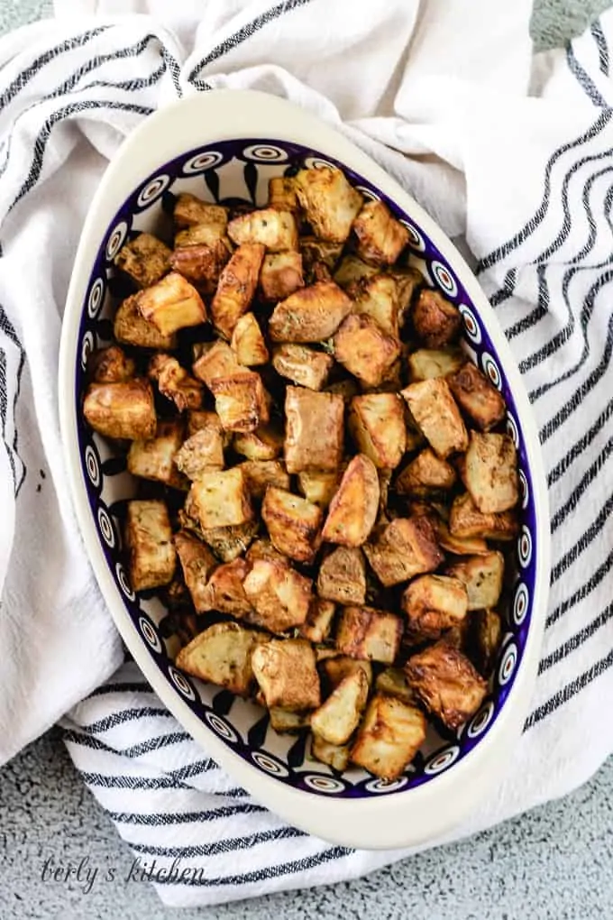 A top-down view of the crispy potatoes in a bowl.