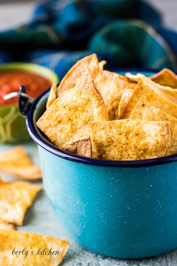 Salsa served alongside the kettle of chips.