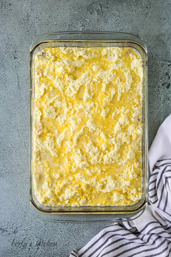 Melted butter has been drizzled over the cake mix.