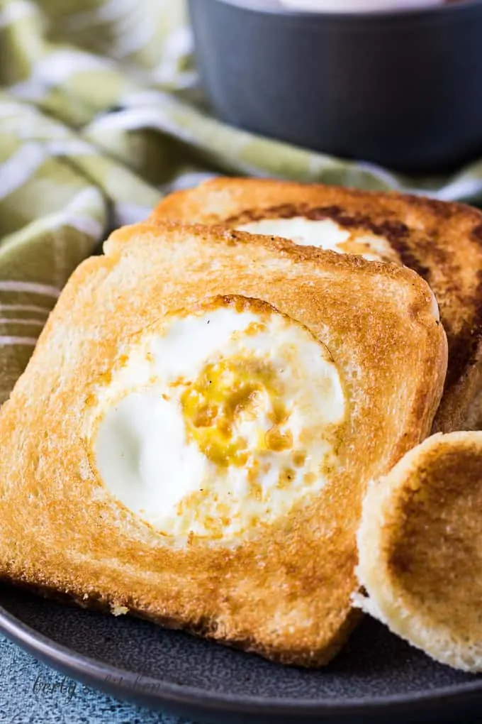 A close-up of the eggs and toast on a plate.