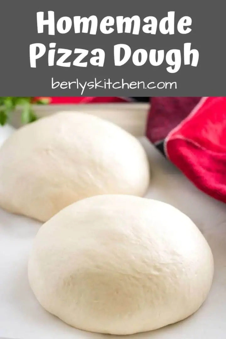 The homemade publix pizza dough balls on a pan.