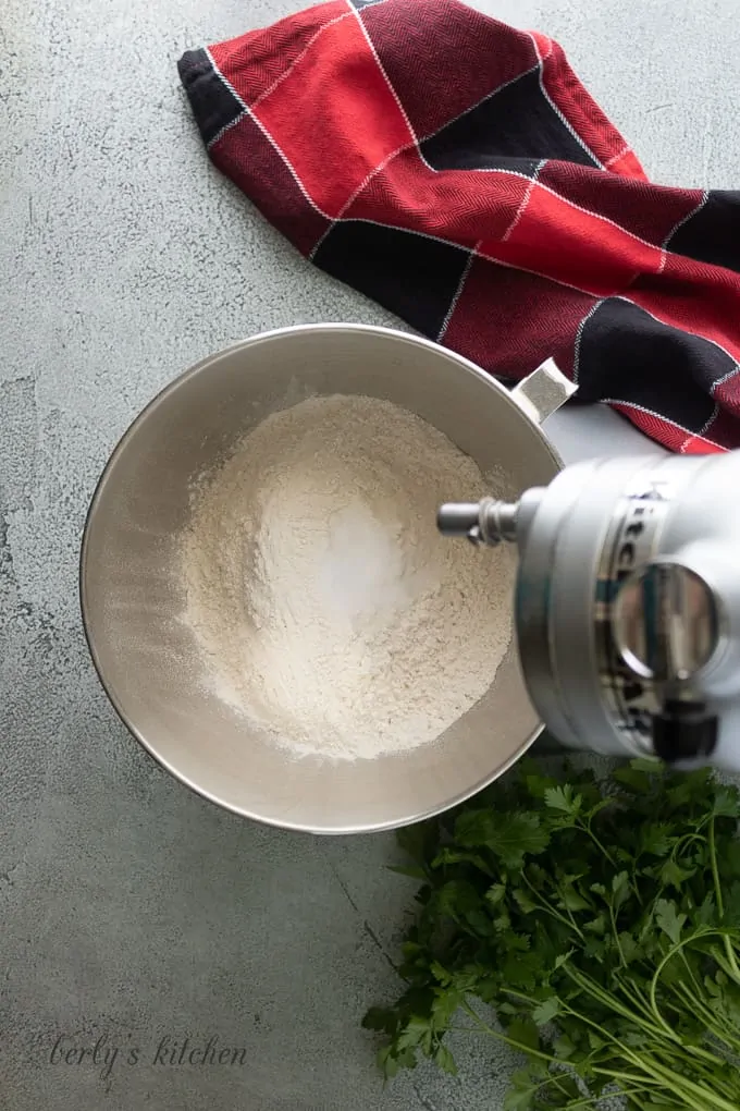 Flour and other dry ingredients in a stand mixer.