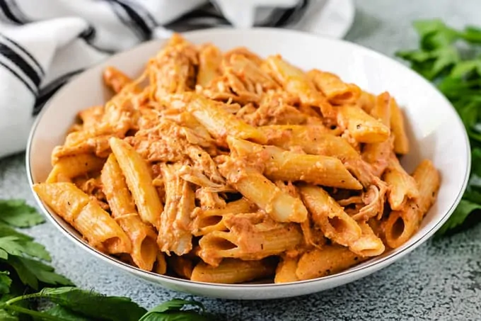 A pasta bowl filled with the slow cooker creamy chicken pasta.