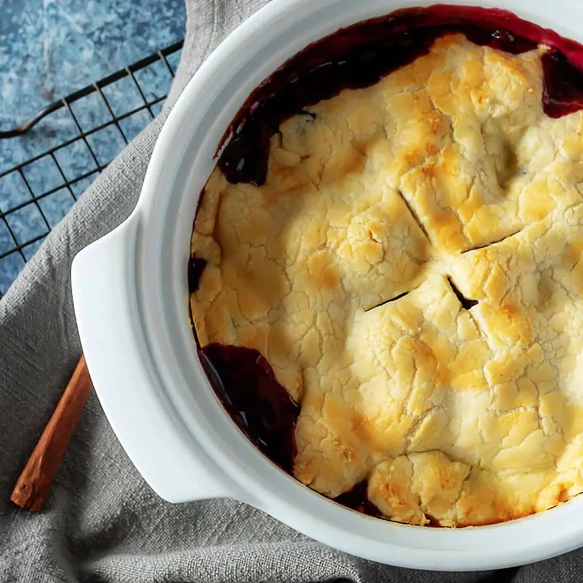 An aerial view of the finished cobbler in a baking dish.