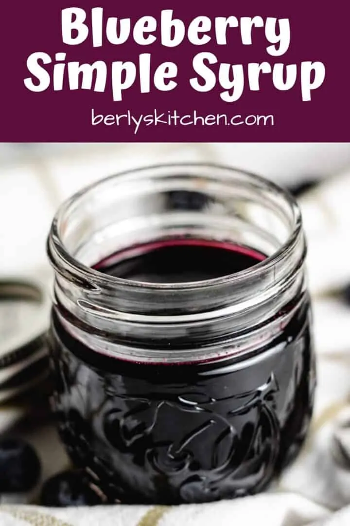 A close-up view of the blueberry simple syrup in a jar.