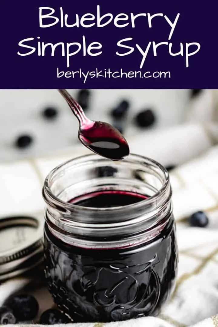 A serving of the blueberry syrup being dipped from the jar.