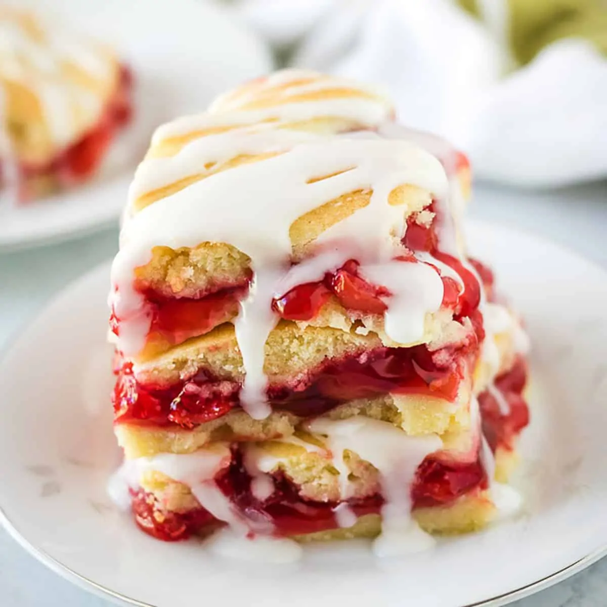 Stack of 3 cherry bars on a white plate.