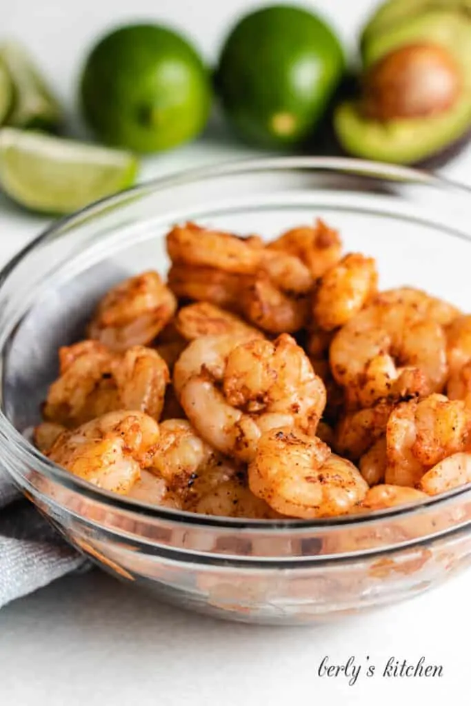 The grilled shrimp in a clean mixing bowl.