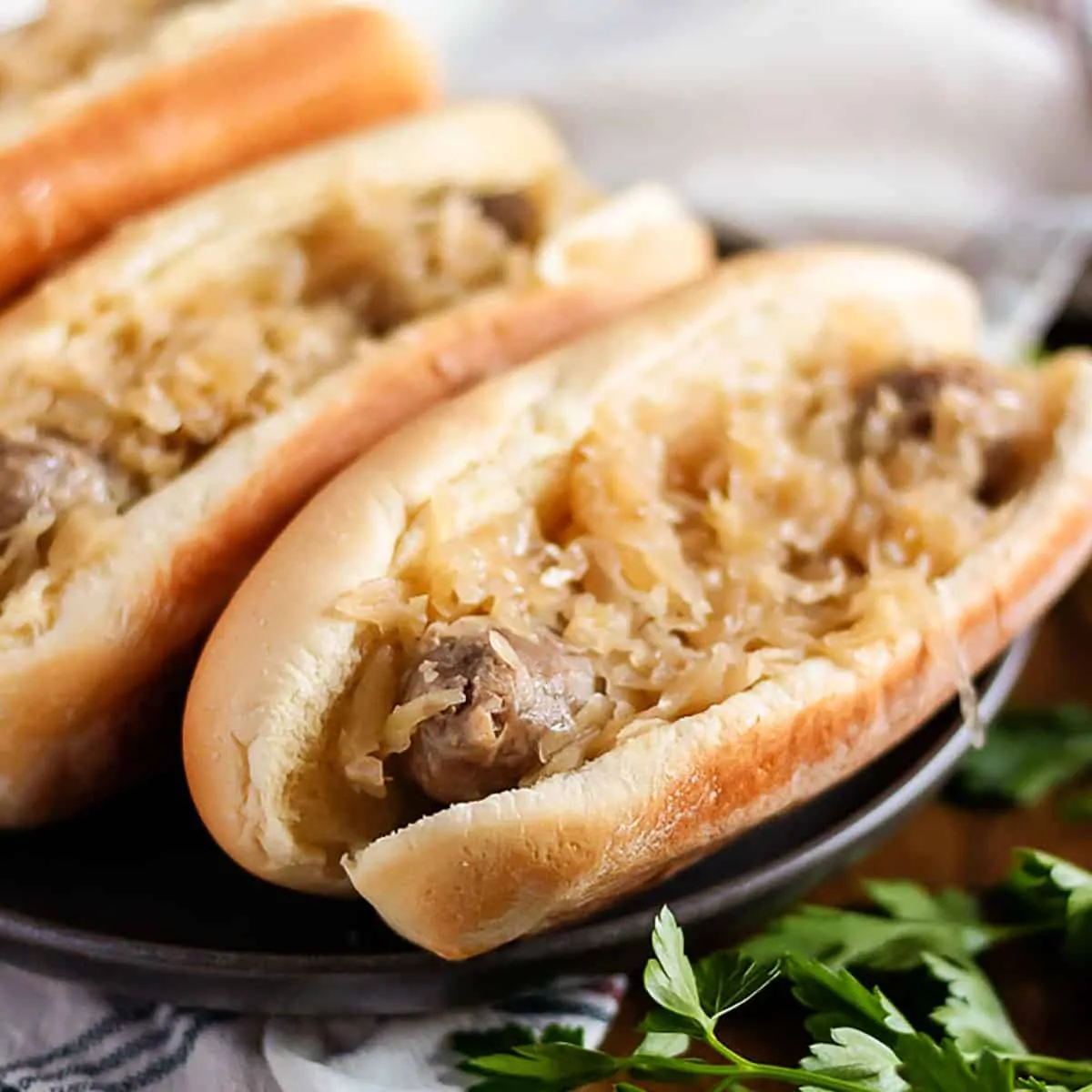 Bratwurst and sauerkraut in a hot do bun.