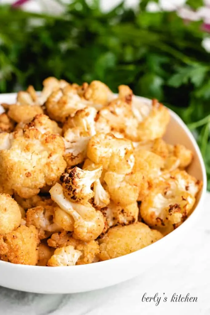 The air fried vegetable served in a white bowl.