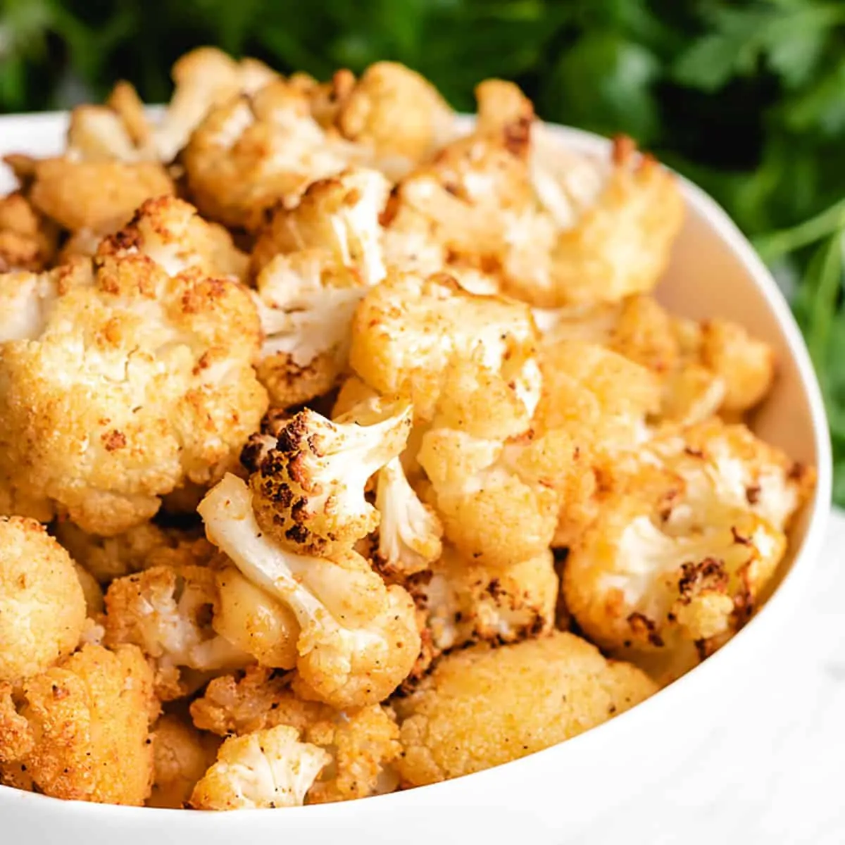 A bowl of seasoned air fryer cauliflower.