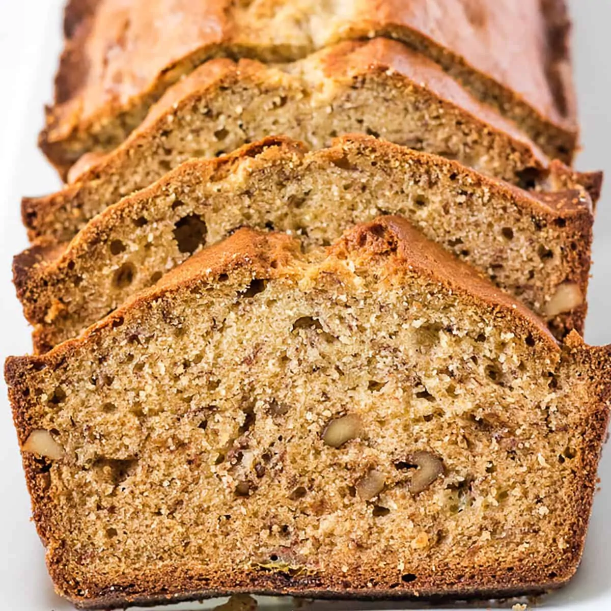 Several slices of banana bread on a platter.