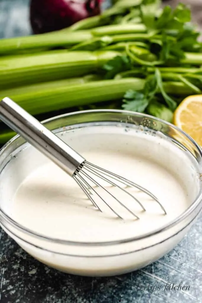 The dressing has been combined using a whisk.