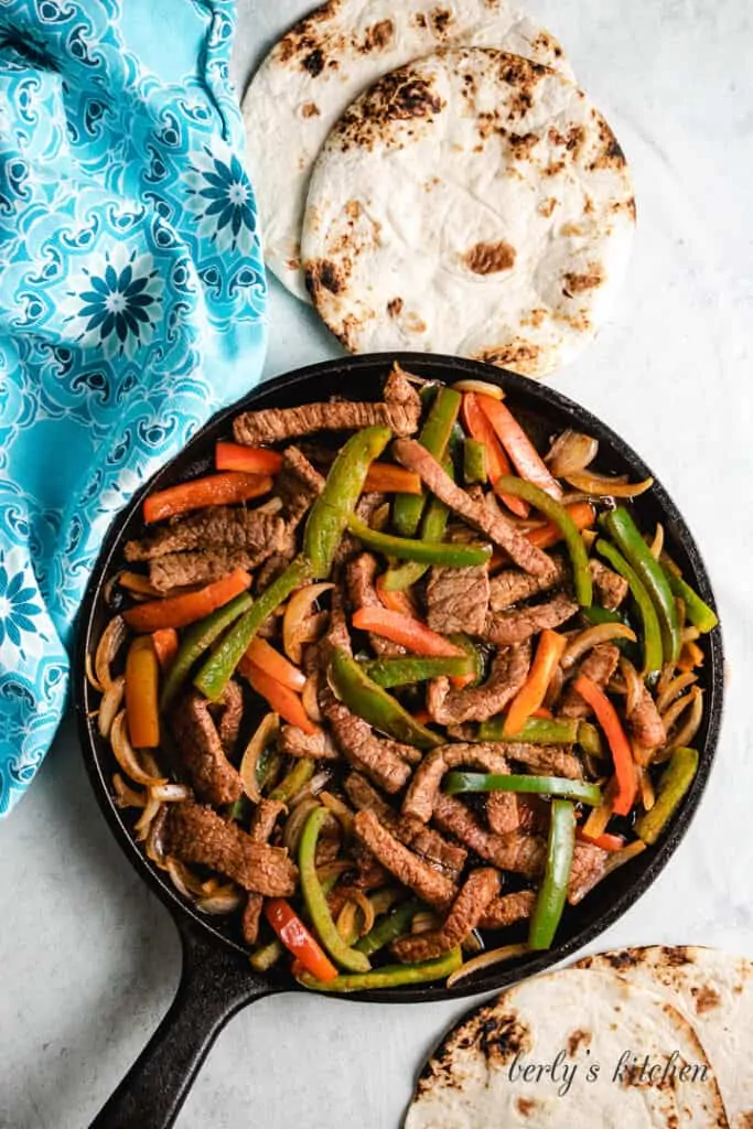 Top-down view of the beef and vegetables in the skillet