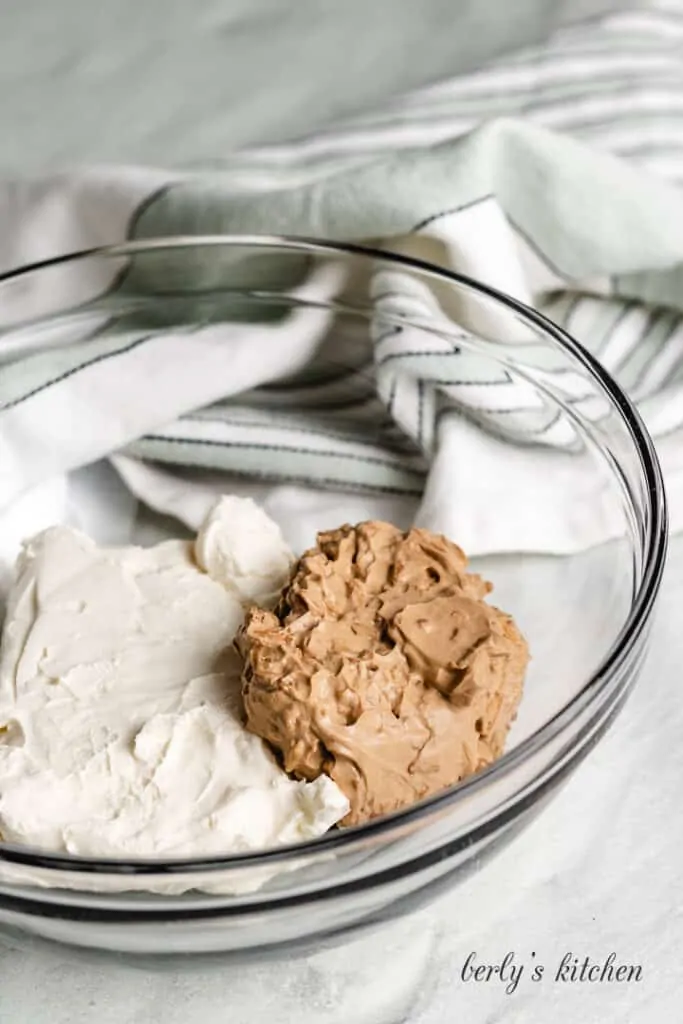 Softened cream cheese added to the mixing bowl.