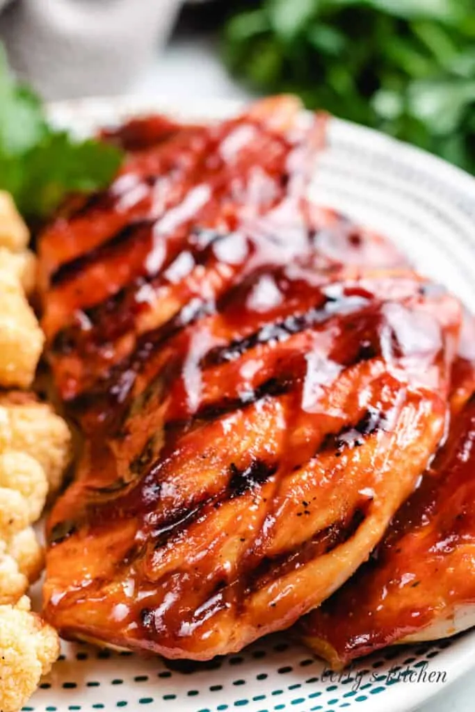 A close-up view of the finished chicken on a plate.