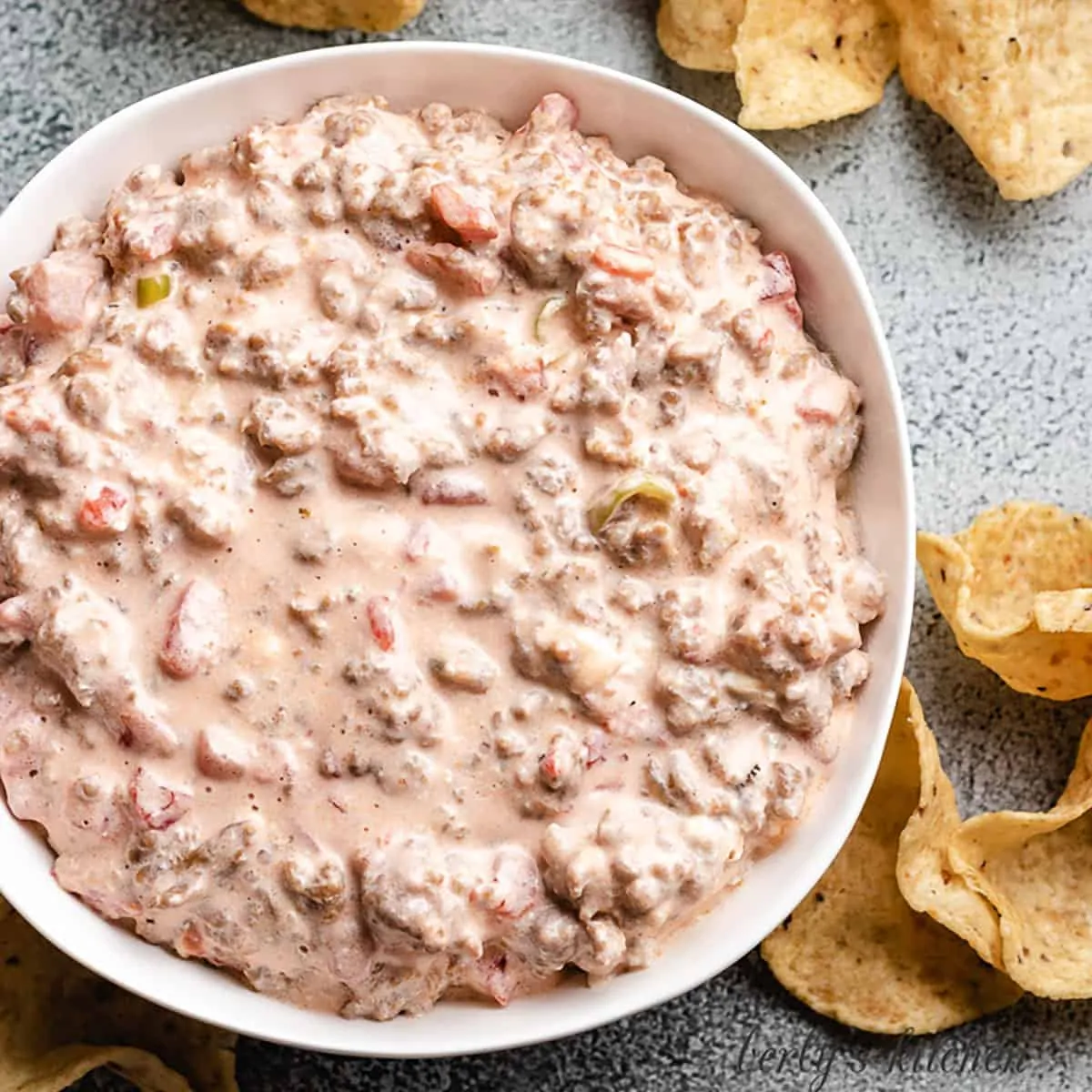 An aerial view of the italian sausage dip with chips.