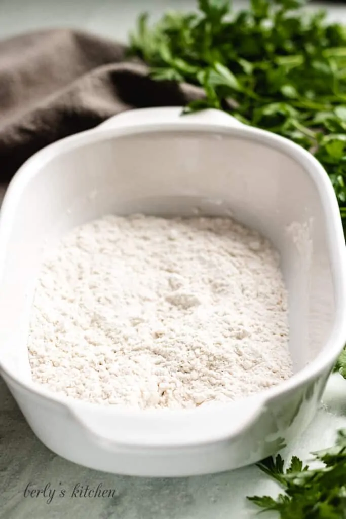 Flour and spices in a baking dish.