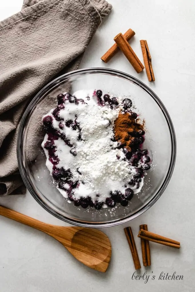 Berries, corn starch and other ingredients in a bowl.